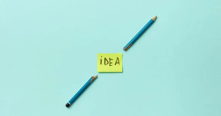 Conceptual photo of a broken pencil with a sticky note labeled 'idea' on a blue background.