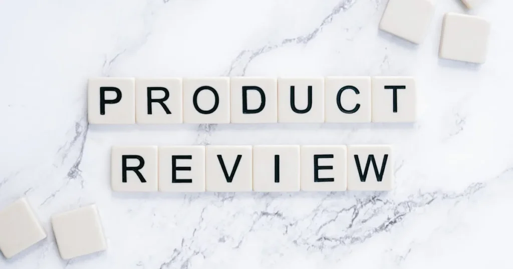 Scrabble tiles spelling 'Product Review' on a marble surface for conceptual illustration.