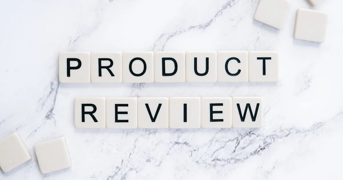 Scrabble tiles spelling 'Product Review' on a marble surface for conceptual illustration.