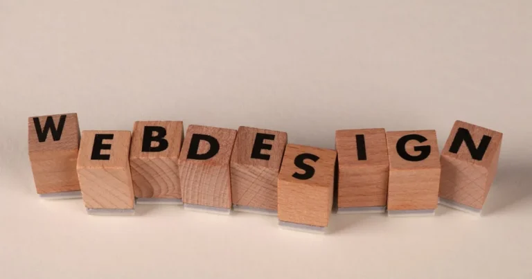 Wooden blocks spelling 'web design' creatively showcase digital design concept.